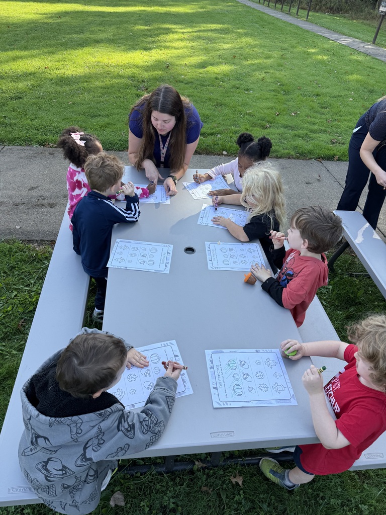 Howland Springs preschool children participate in outdoor storybook activities inspired by The Acorn and the Oak, exploring letters, acorns and tree growth.