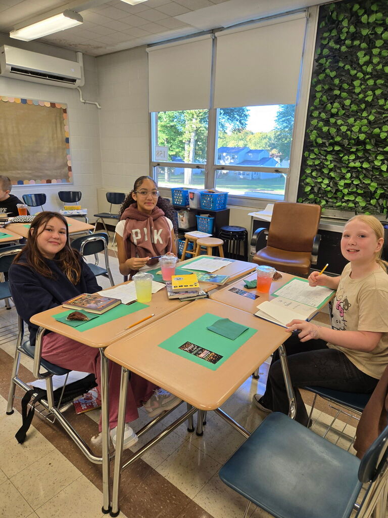 Howland Intermediate School sixth-grade students in Mrs. Olesky and Miss Less’ class preview books and enjoy drinks during their Starbooks Café activity in ELA.