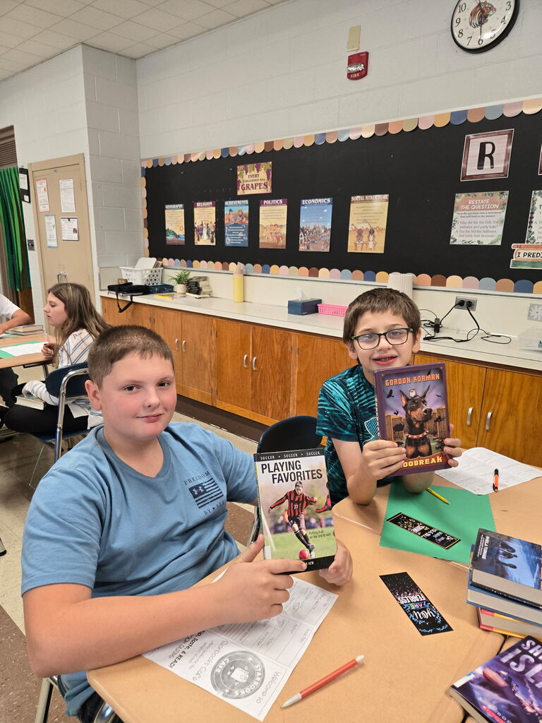 Howland Intermediate School sixth-grade students in Mrs. Olesky and Miss Less’ class preview books and enjoy drinks during their Starbooks Café activity in ELA.
