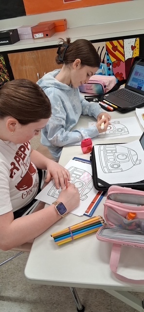 Howland Intermediate School students participate in Ohio Code Scholar, with Kenley and Ryeliegh working on Arduino wiring and audio while classmates develop ideas for 3D designs.