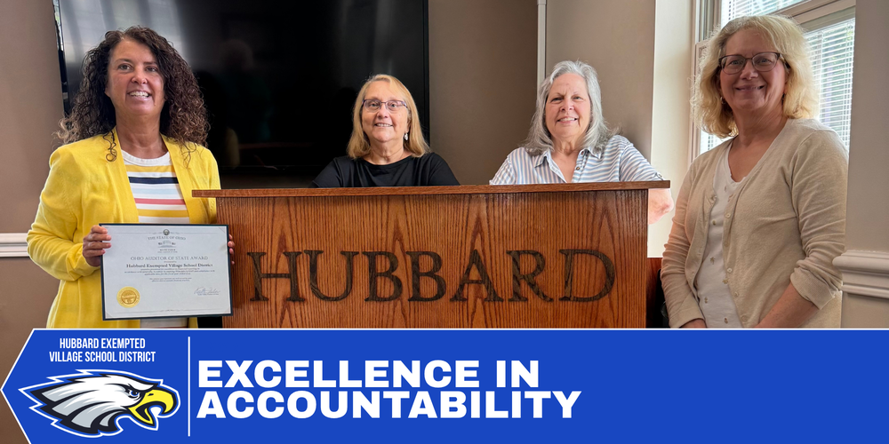 Hubbard Schools officials pose with representatives from the Ohio Auditor of State's Office while displaying awards recognizing a clean audit and excellence in government transparency.