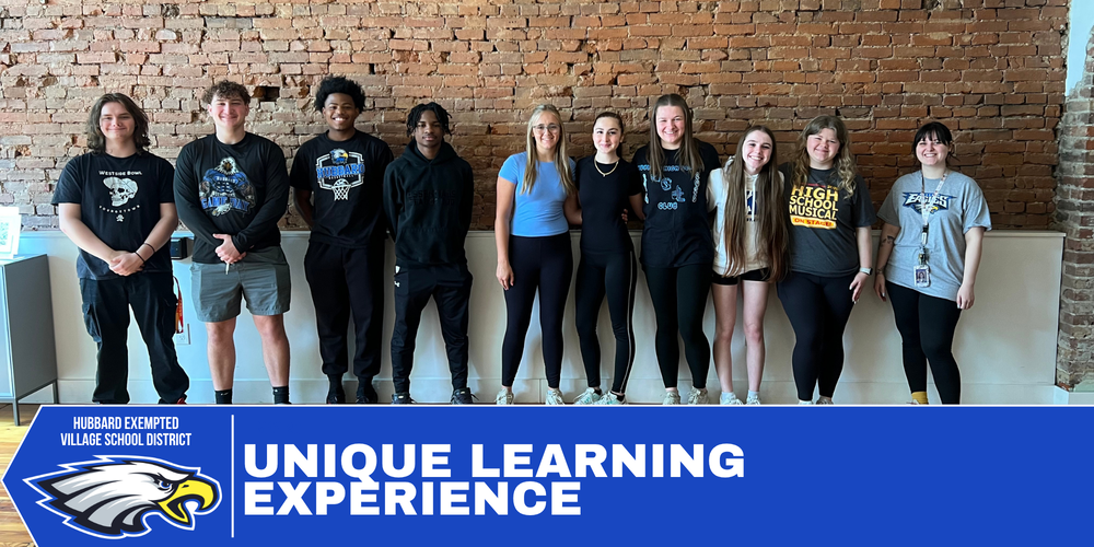 Students participate in a yoga class while observing accessibility features designed for Deaf participants.