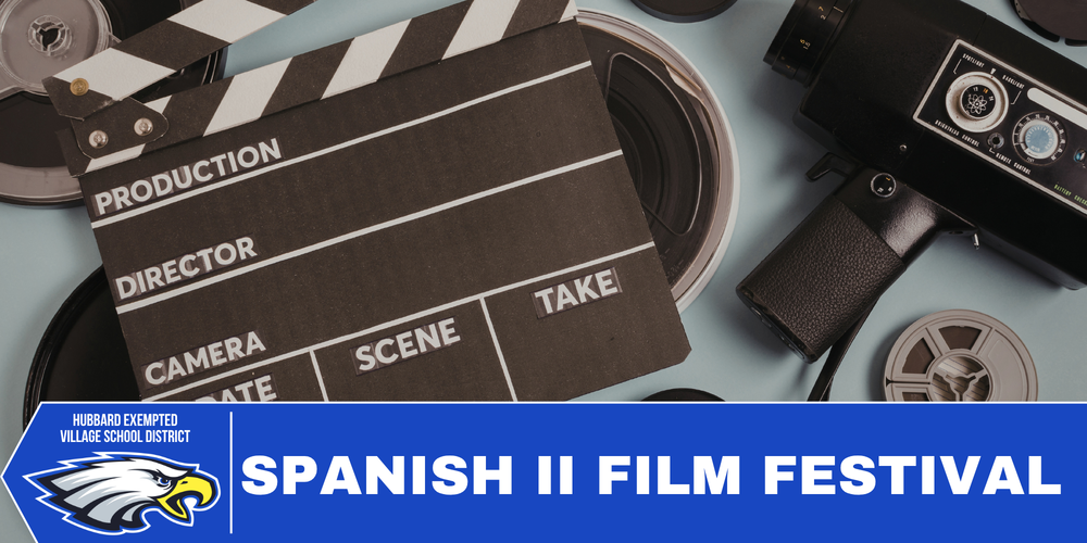 Close-up of movie props including a clapperboard, camera equipment, and film tape 