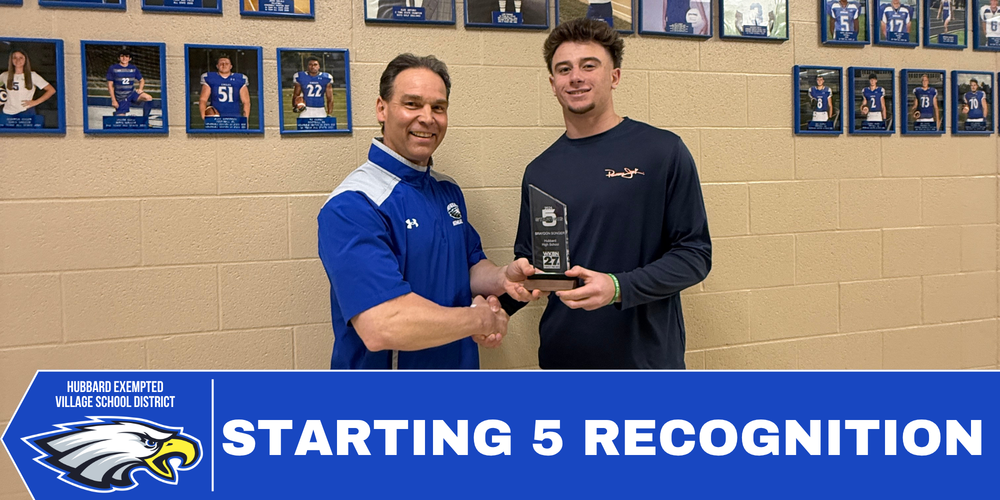 Braydon Songer stands next to Brian Hoffman while posing with his WKBN 2026 Starting 5 basketball award.