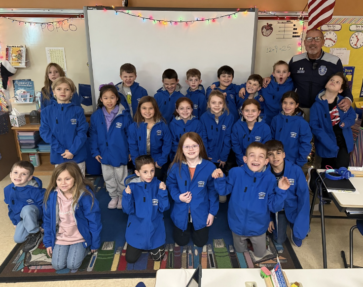 Second graders receive Eagles coats