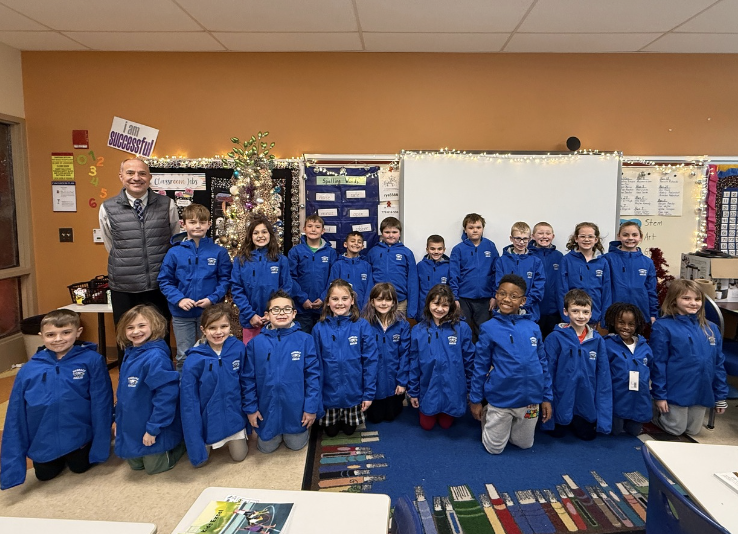 Second graders receive Eagles coats