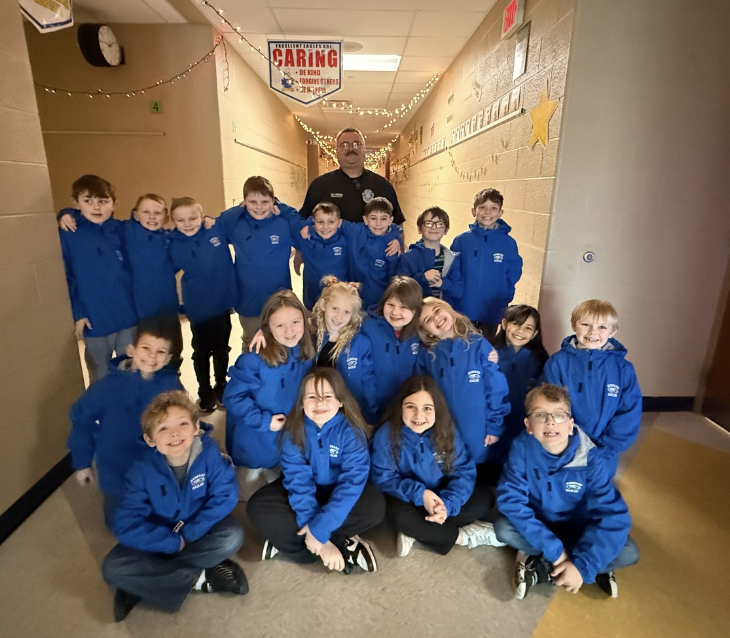 Second graders receive Eagles coats