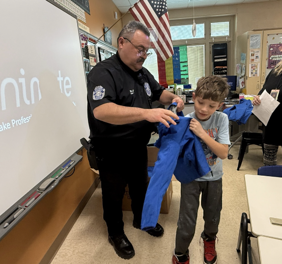 Second graders receive Eagles coats