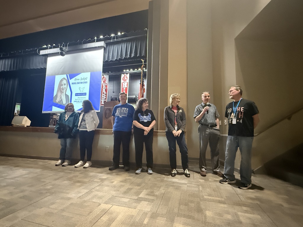 Group of Hubbard Schools retirees standing together at a staff event, smiling as they are recognized for their years of service to the district.
