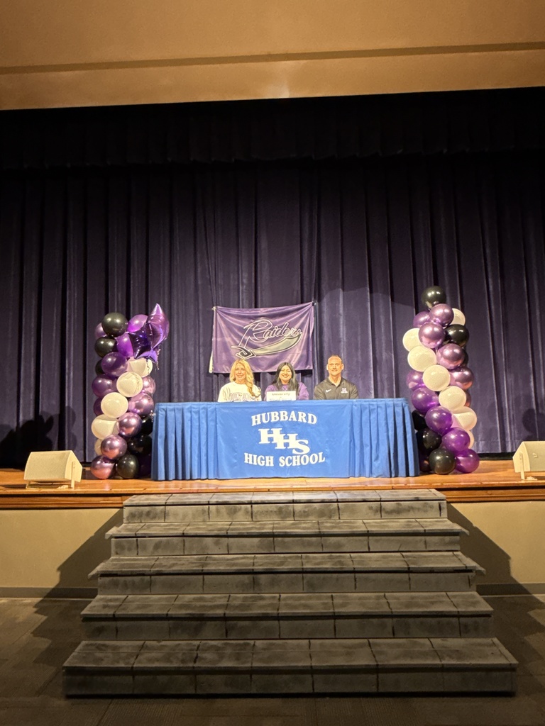 Gabi Gasser: Student-athlete signing a letter of intent for cheerleading at Mount Union, seated with family and coaches nearby.