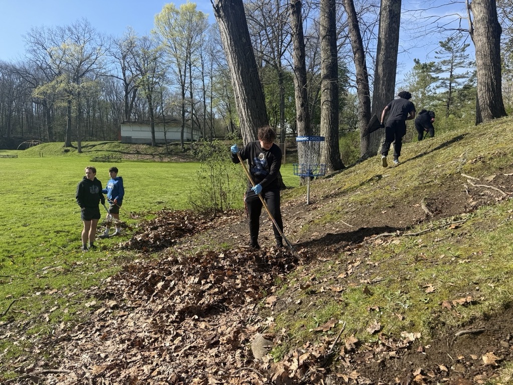 Hubbard High School seniors volunteer outdoors cleaning parks and helping community organizations during Senior Service Day.