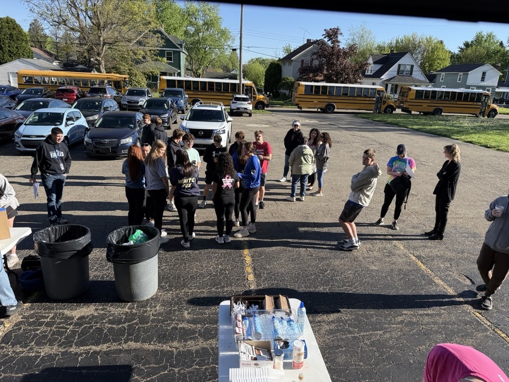 Hubbard High School seniors volunteer outdoors cleaning parks and helping community organizations during Senior Service Day.