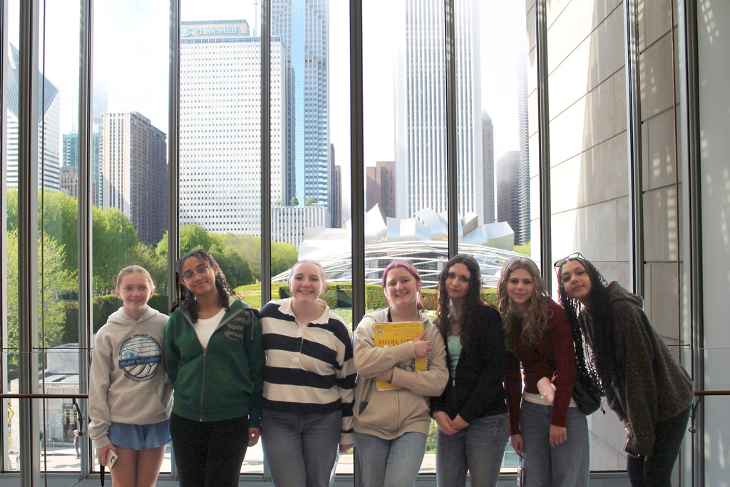 Hubbard High School students pose in Chicago near famous landmarks during an educational band and art trip.