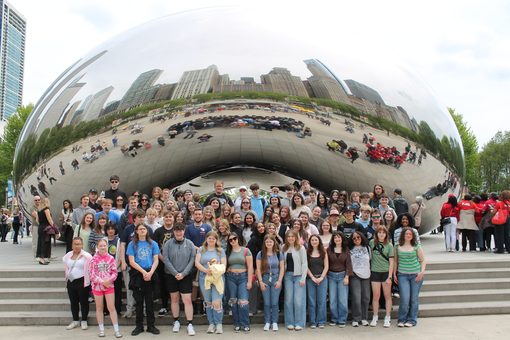 Hubbard High School students pose in Chicago near famous landmarks during an educational band and art trip.