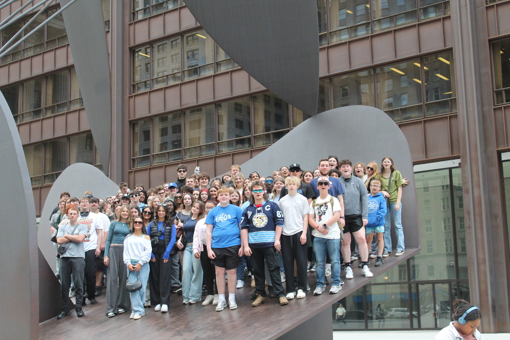 Hubbard High School students pose in Chicago near famous landmarks during an educational band and art trip.