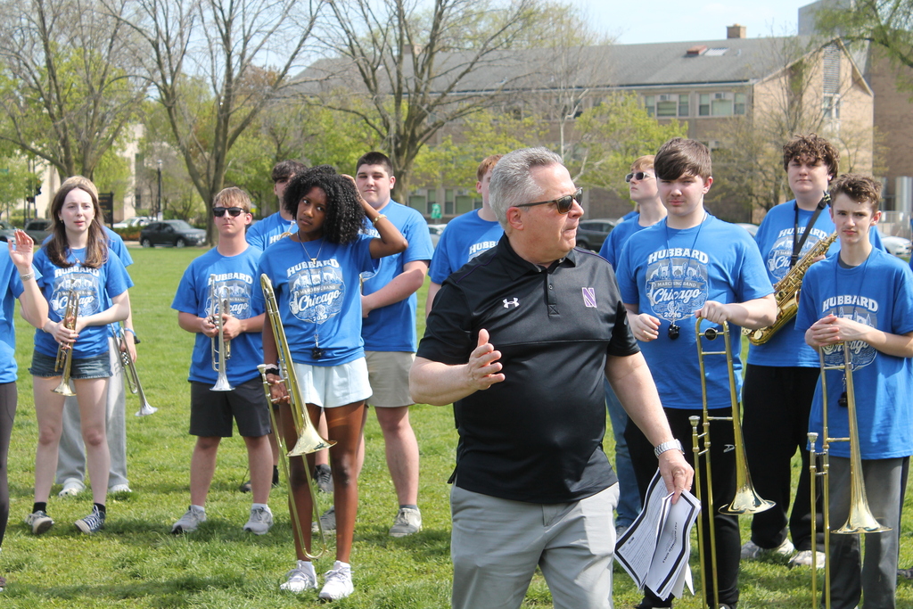 Hubbard High School students pose in Chicago near famous landmarks during an educational band and art trip.