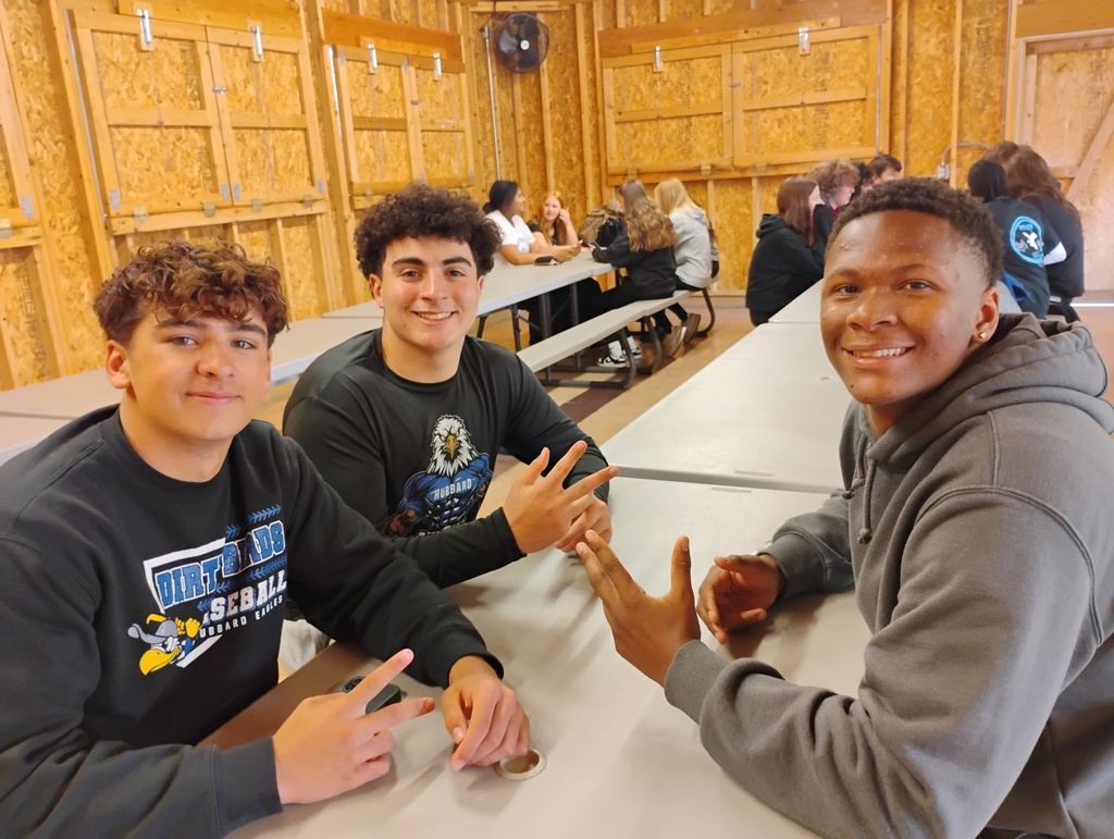 Hubbard High School ASL Club students gather outdoors at Harding Park enjoying food, games, and activities during an end-of-year picnic.