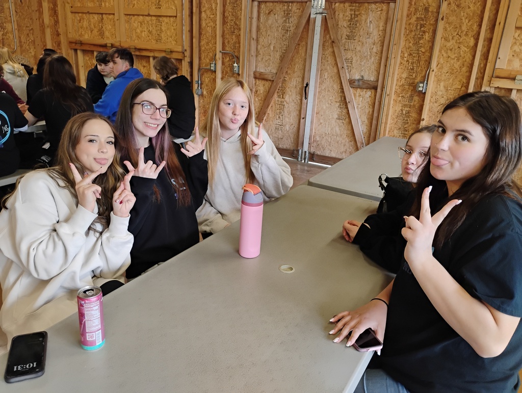 Hubbard High School ASL Club students gather outdoors at Harding Park enjoying food, games, and activities during an end-of-year picnic.