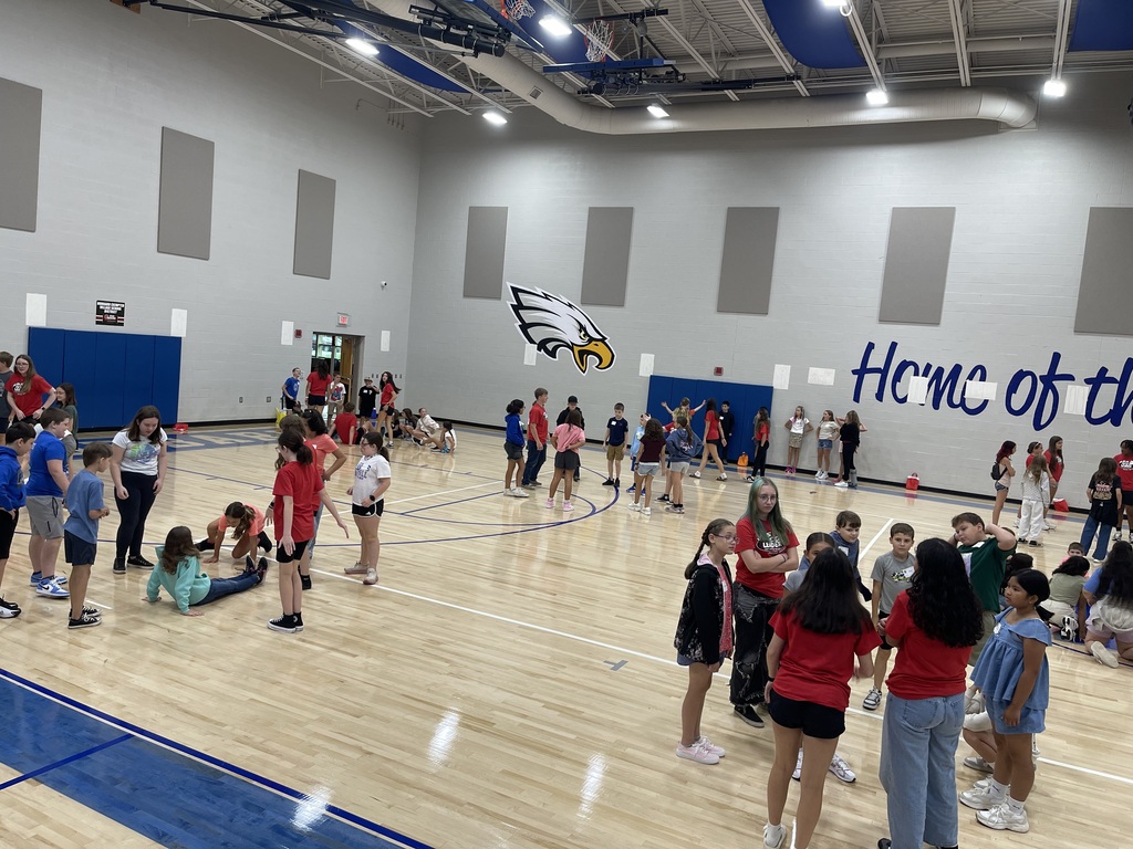 8th grade WEB Leaders welcome and assist 5th grade students during orientation at Hubbard Middle School, helping them learn about their new school and connect with classmates.