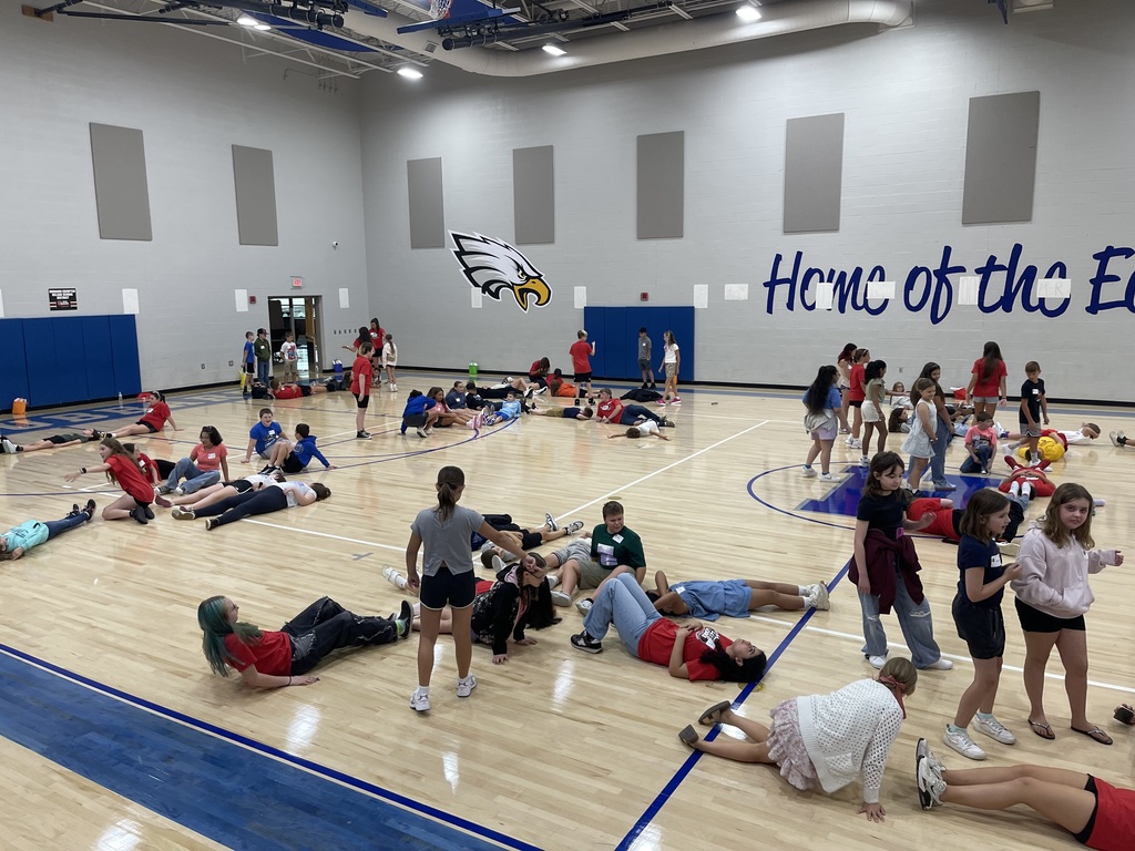 8th grade WEB Leaders welcome and assist 5th grade students during orientation at Hubbard Middle School, helping them learn about their new school and connect with classmates.
