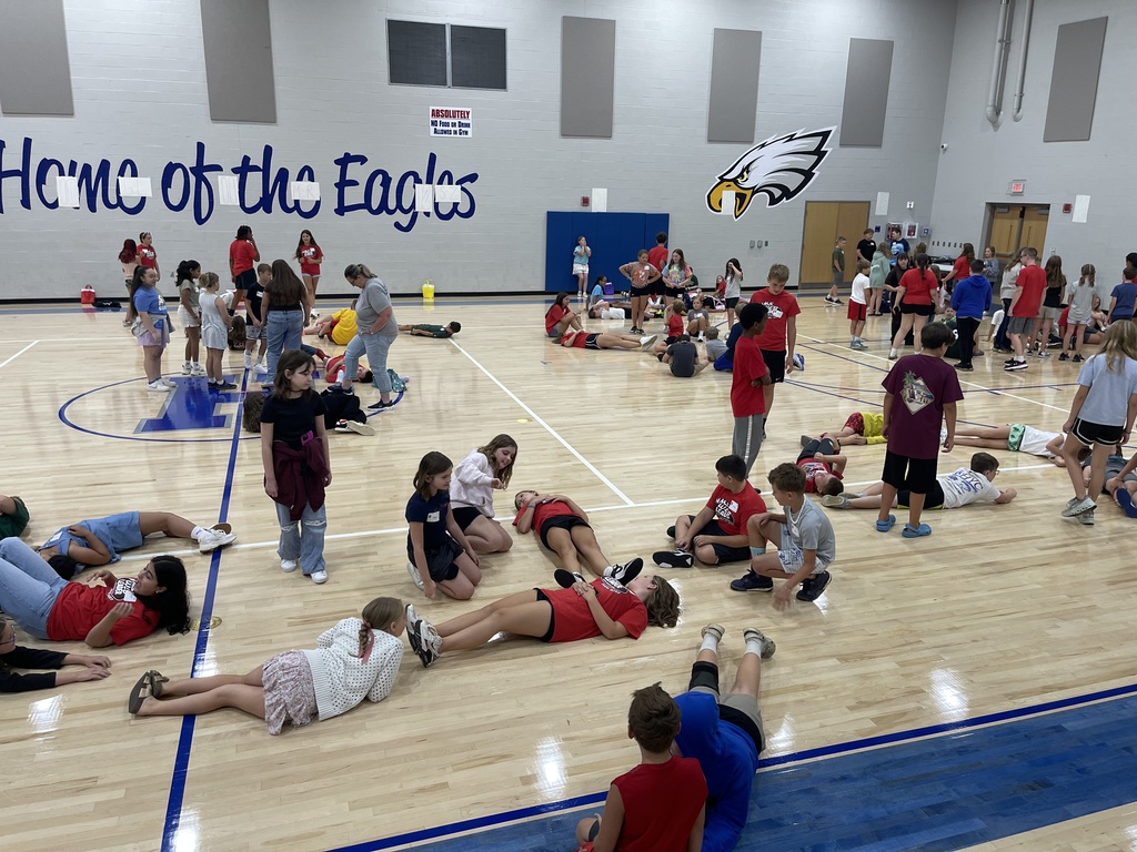 8th grade WEB Leaders welcome and assist 5th grade students during orientation at Hubbard Middle School, helping them learn about their new school and connect with classmates.