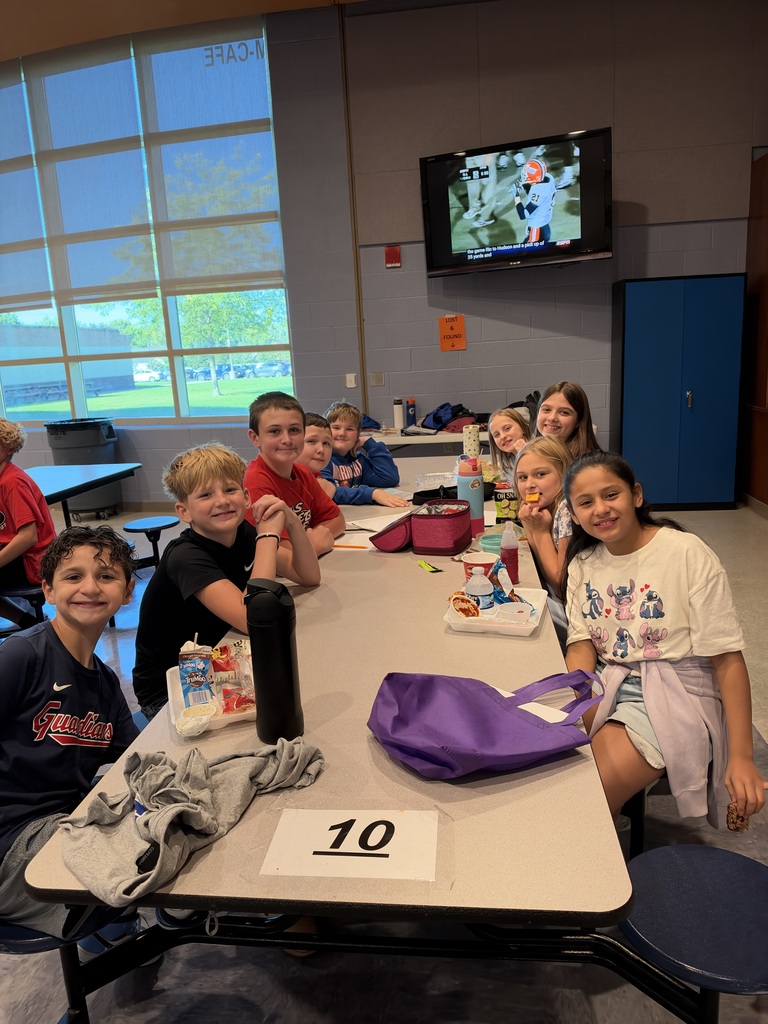8th-grade WEB Leaders meet with their 5th-grade buddies during a first-month middle school check-in.