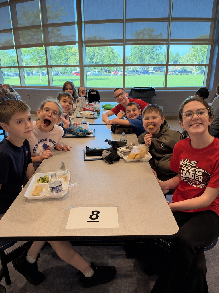 8th-grade WEB Leaders meet with their 5th-grade buddies during a first-month middle school check-in.