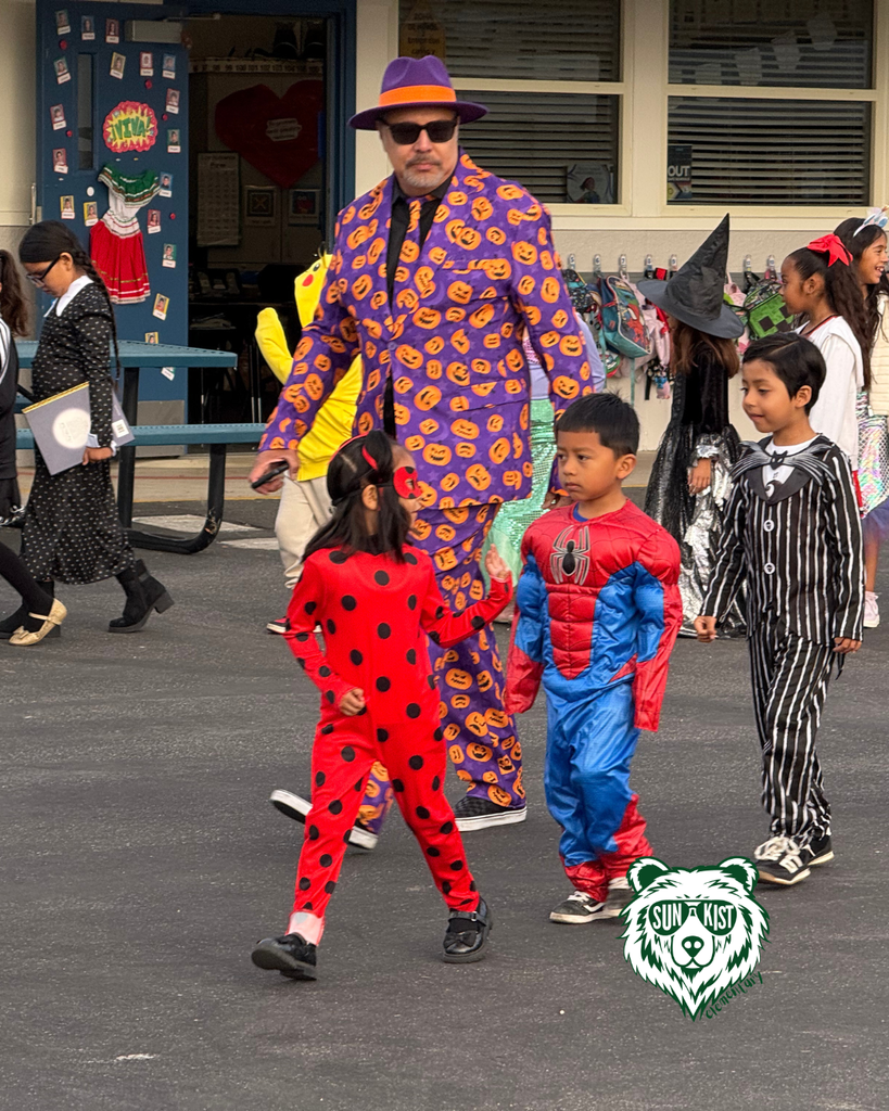 kids celebrating Halloween Teacher dress for halloween