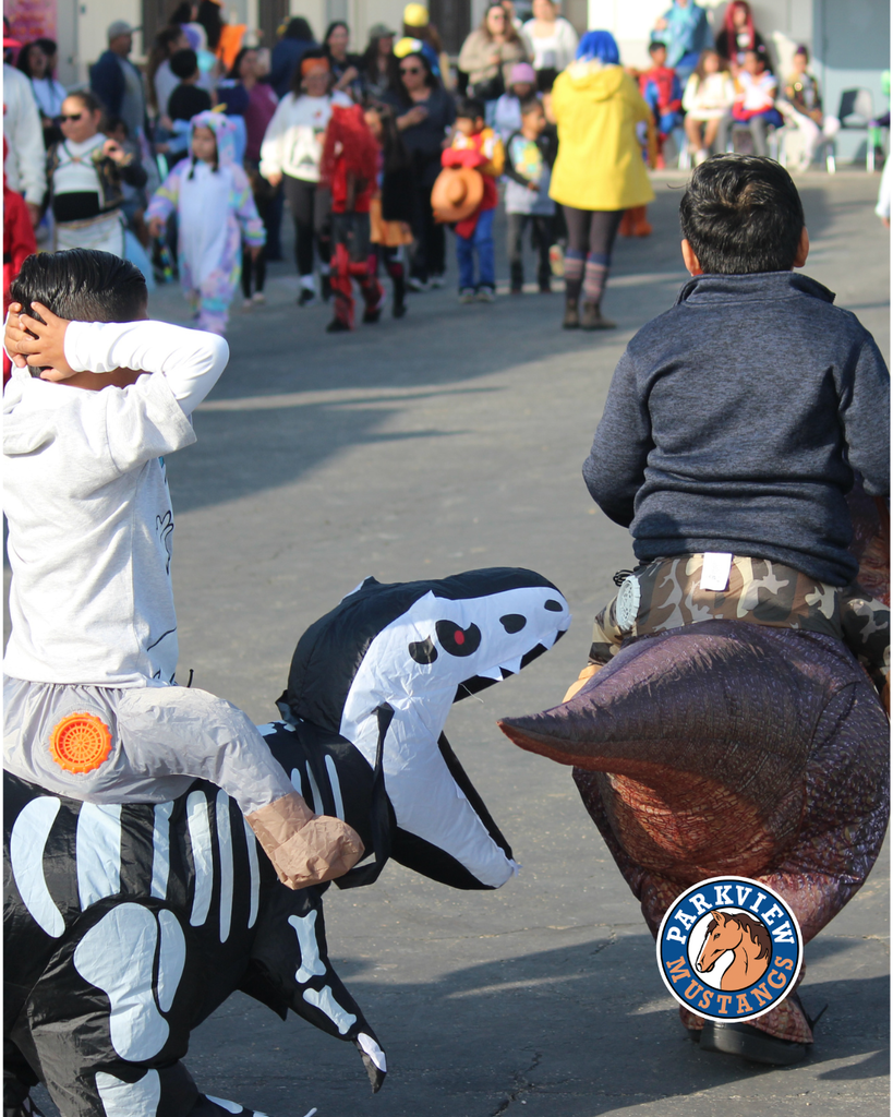 kids dressed in costumes celebrating Halloween