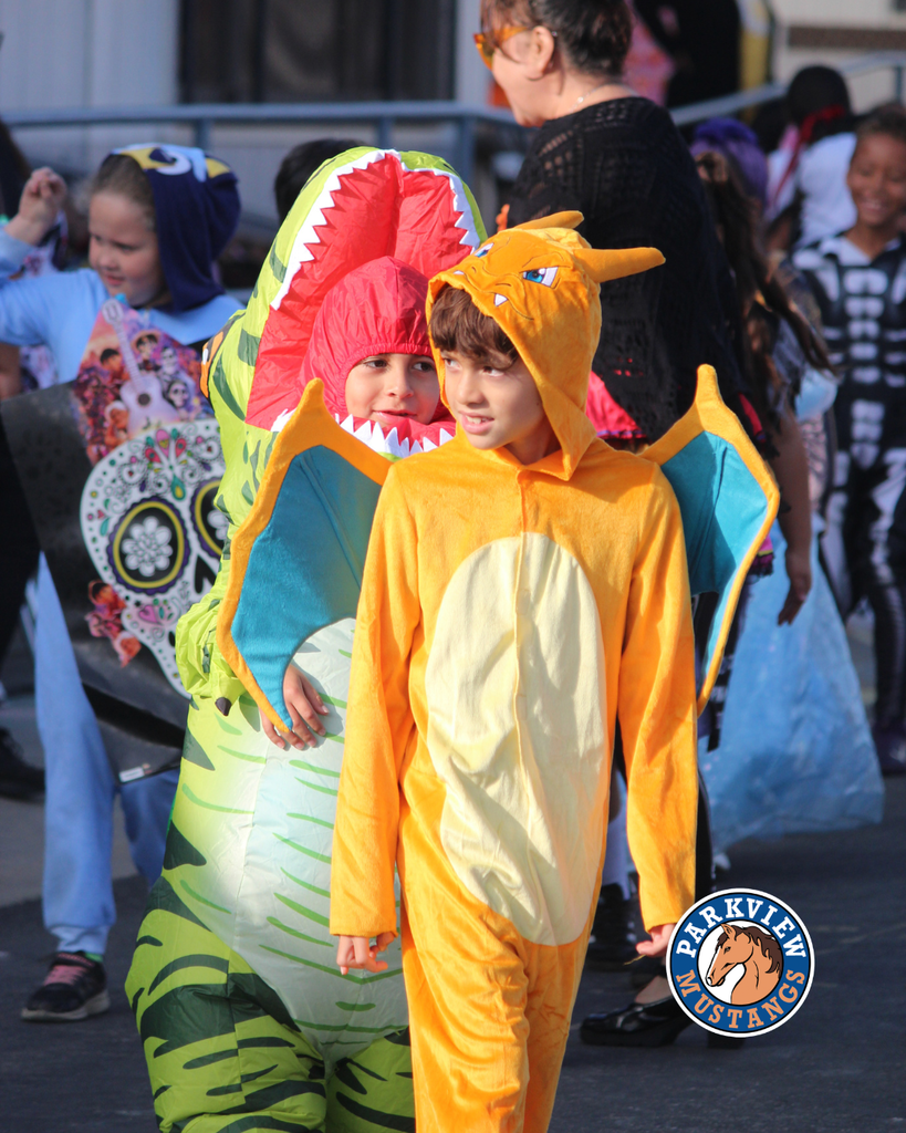 kids dressed in costumes celebrating Halloween
