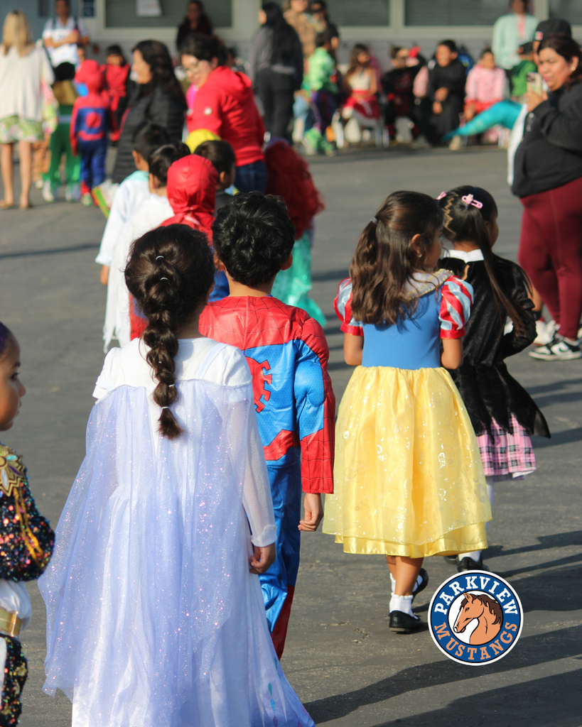 kids dressed in costumes celebrating Halloween