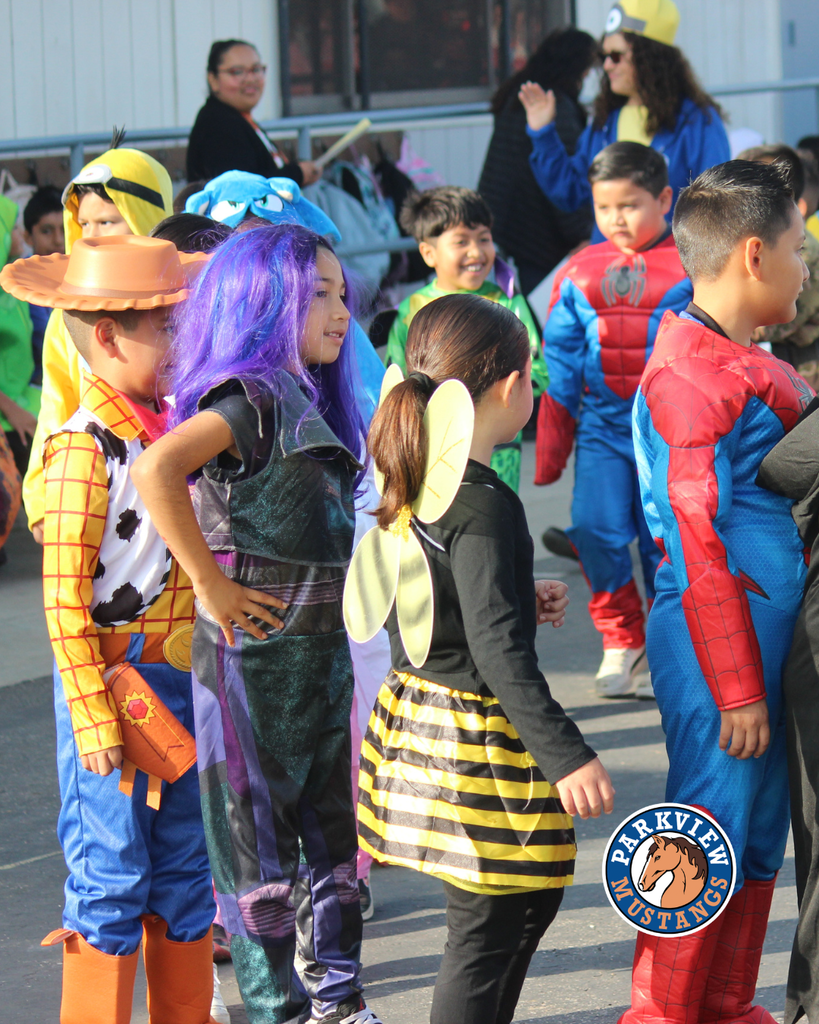 kids dressed in costumes celebrating Halloween