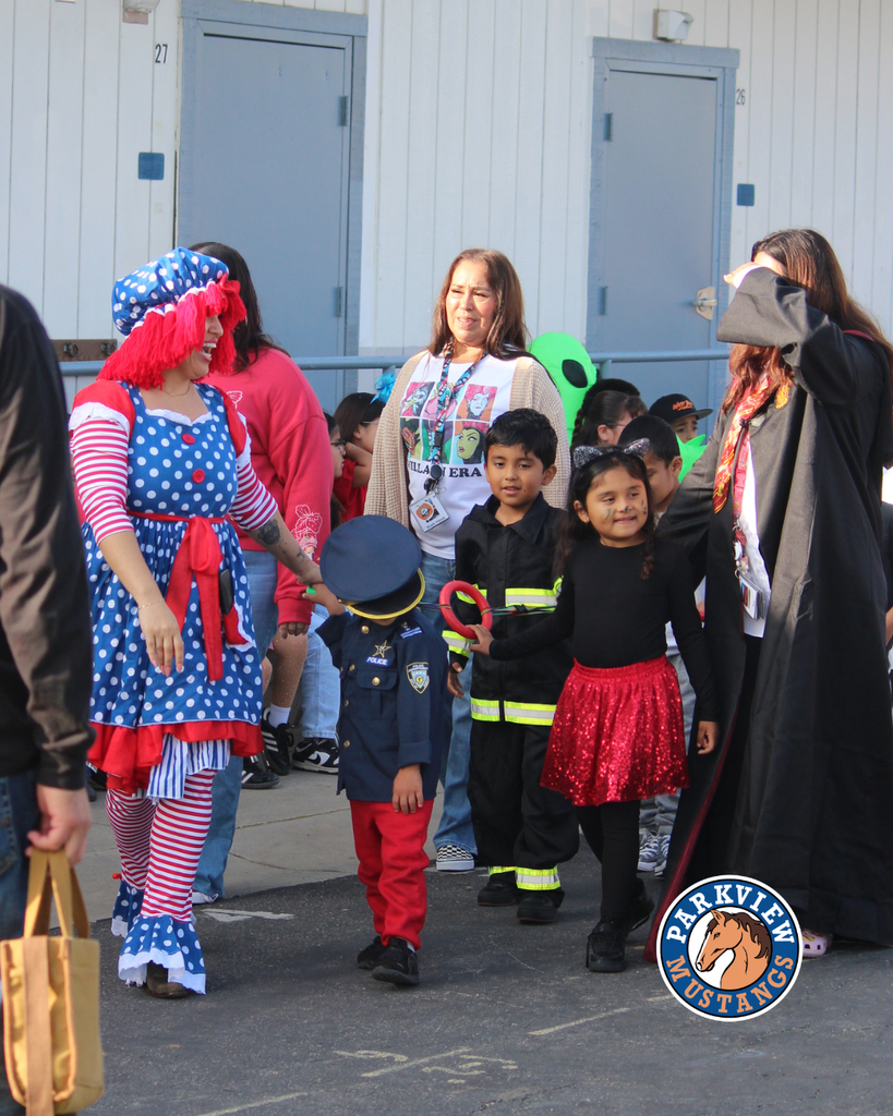 kids dressed in costumes celebrating Halloween