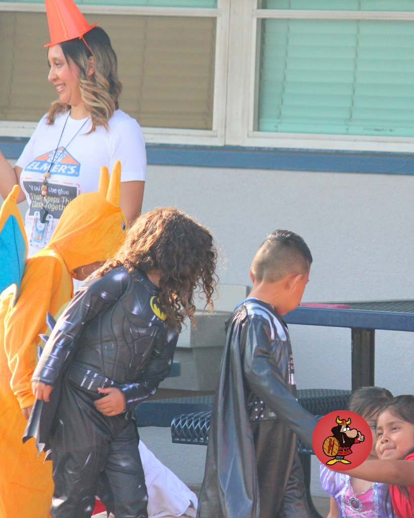 kids dressed in costumes celebrating Halloween