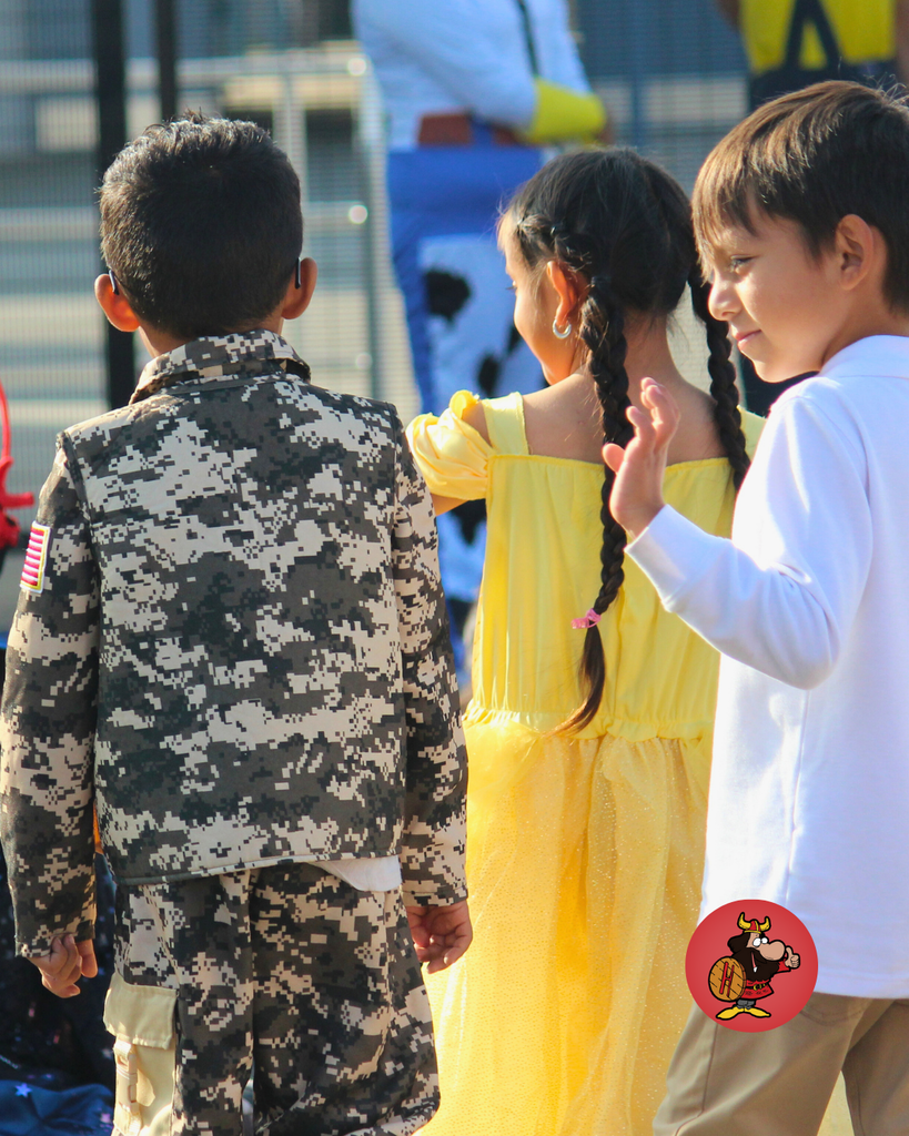 kids dressed in costumes celebrating Halloween