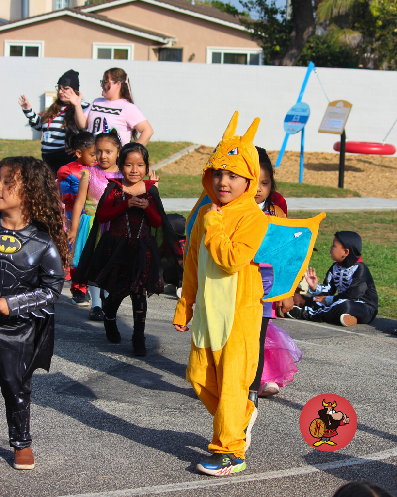 kids celebrating Halloween Teacher dress for halloween