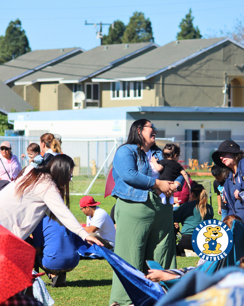 family laughing at picnic