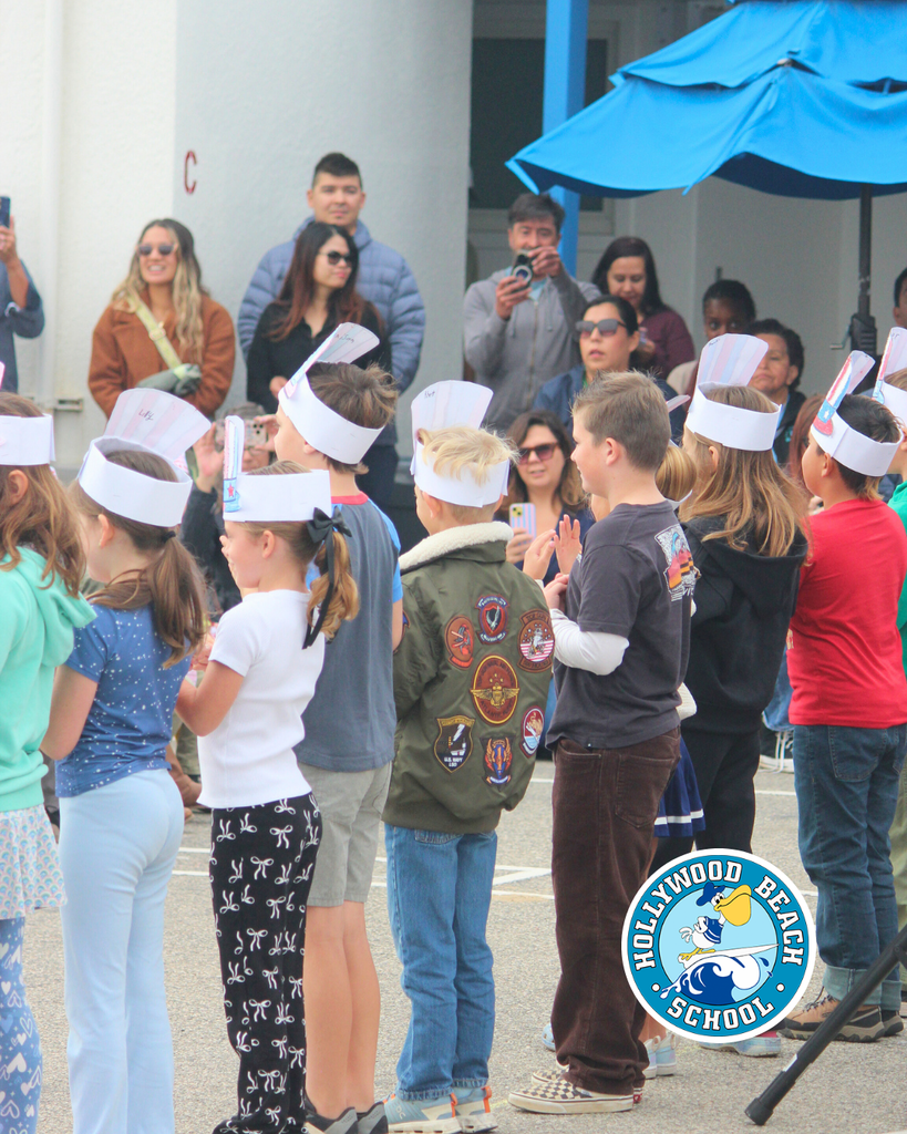 kids lined up singing a song to celebrate Veterans Day