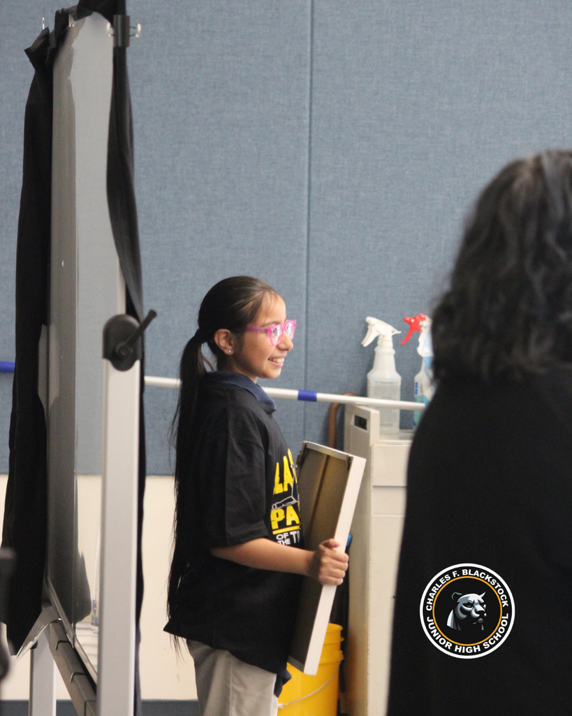 student smiling with award taking pictire