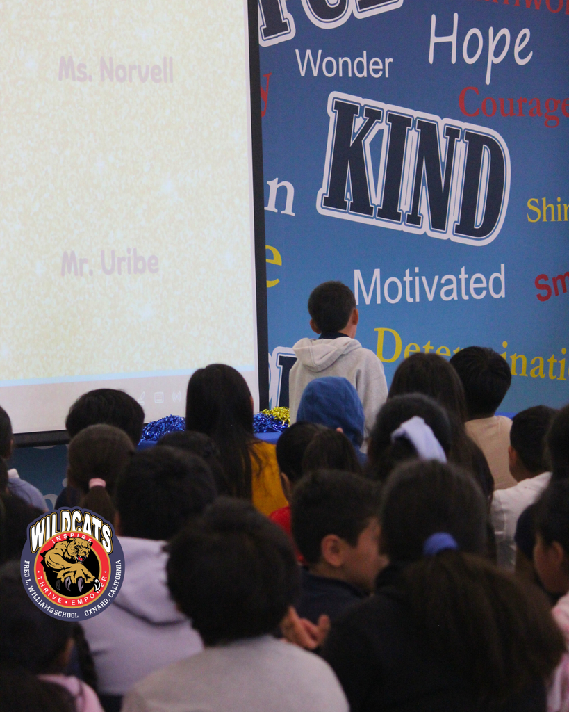 student walking to accept award