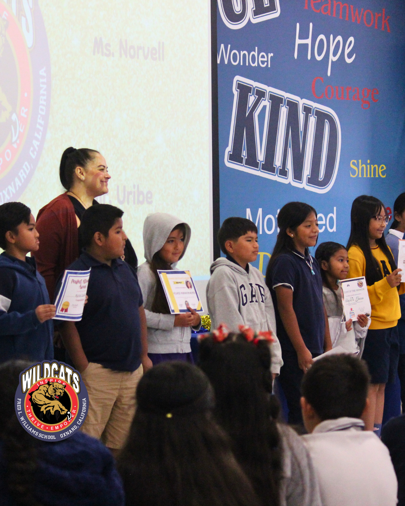 teacher and students pose for group photo