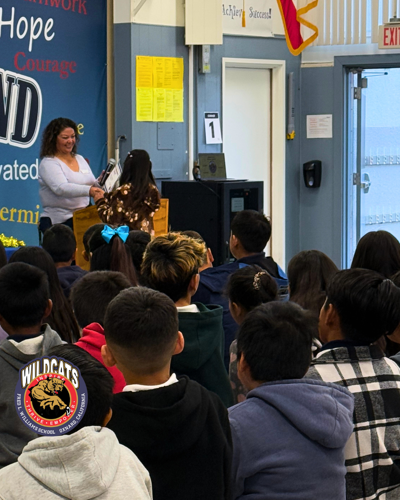 student walking to accept award