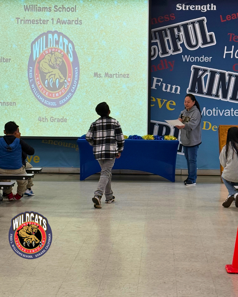 student walking to accept award