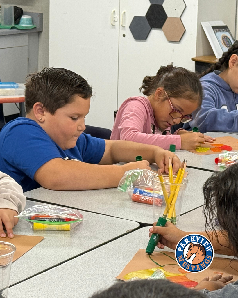 students creating art in class