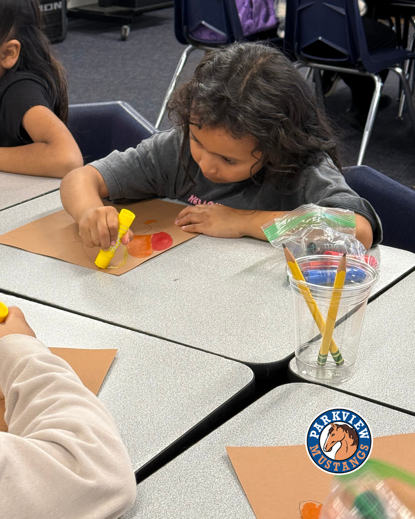 students creating art in class