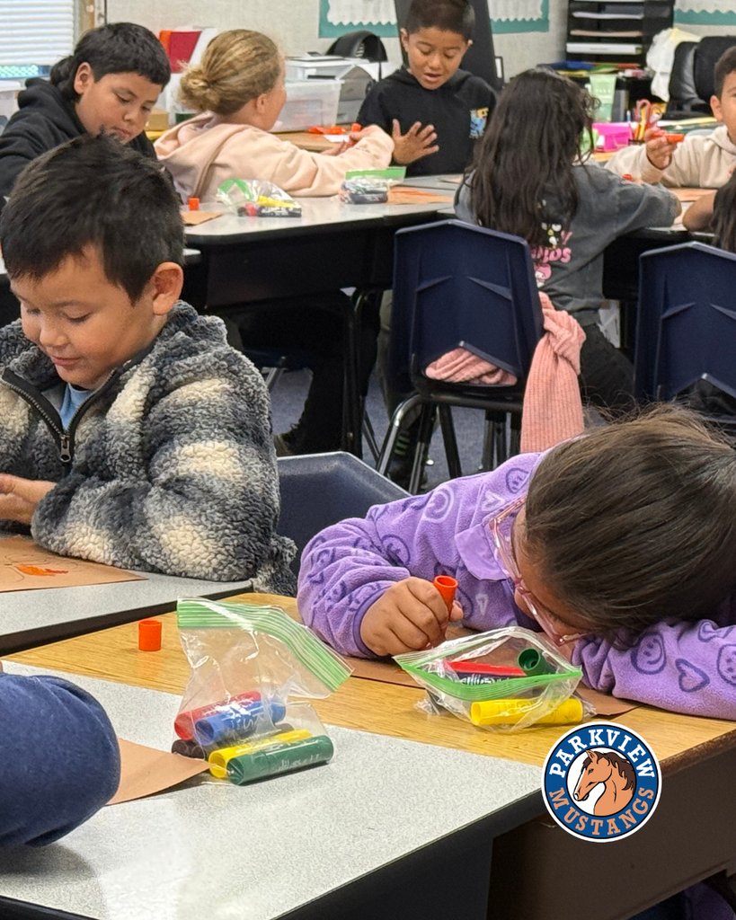 students creating art in class