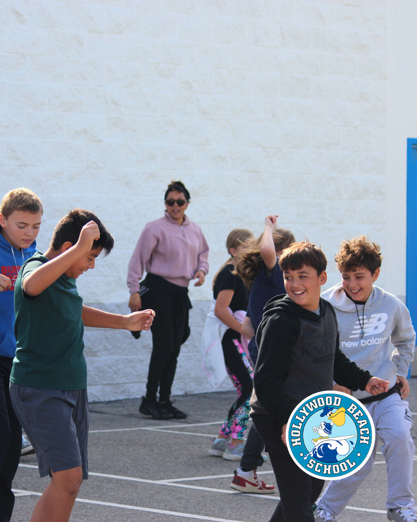 Ms.Jenna teaching line dancing to Ms. Thompson's 5th grade class.  