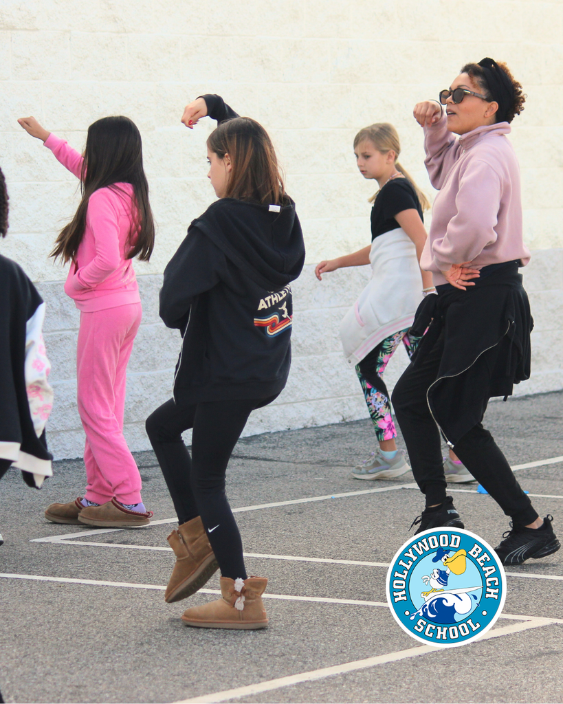 Ms.Jenna teaching line dancing to Ms. Thompson's 5th grade class.  