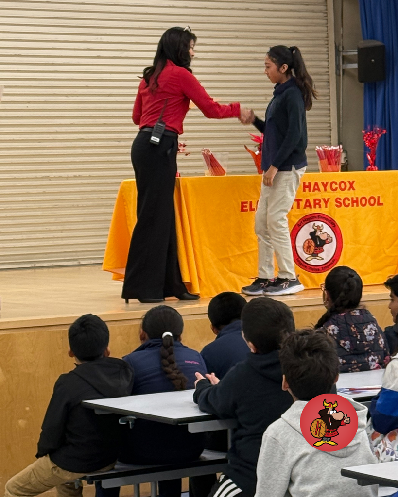 Students being honored with certificates