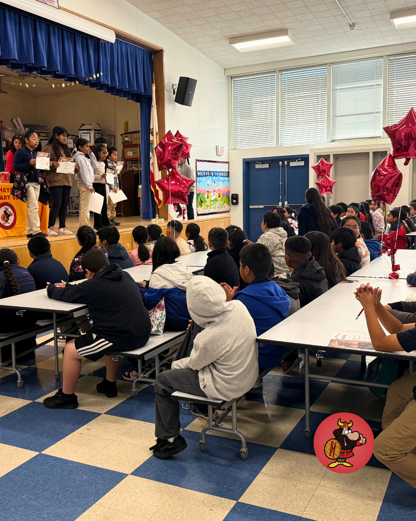 Students being honored with certificates